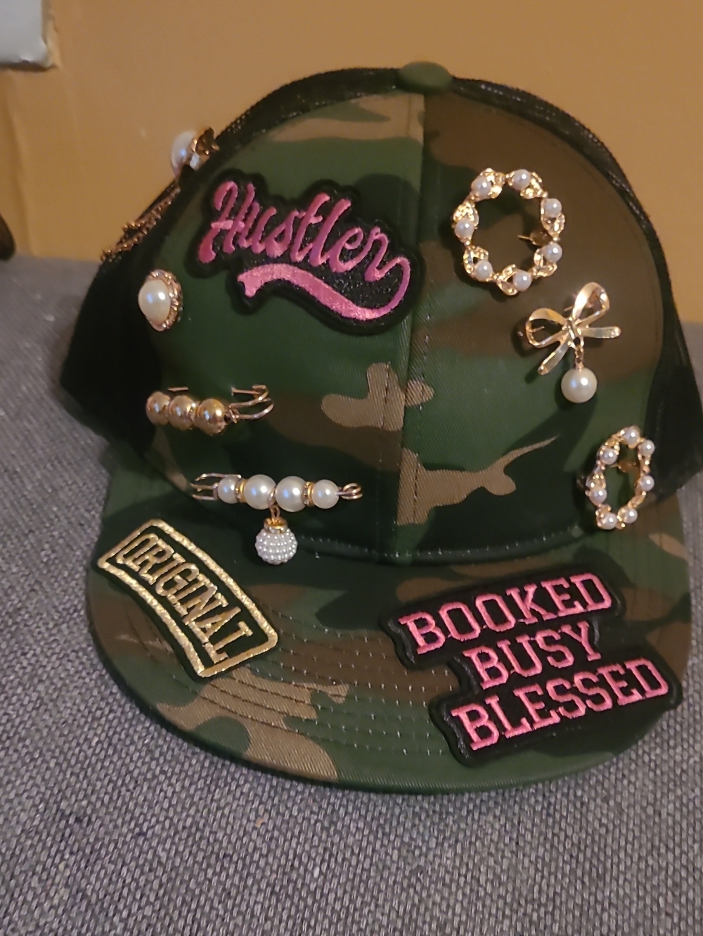 Camo Baseball Cap with Pink 'Hustler' Patch and Pearl Accents